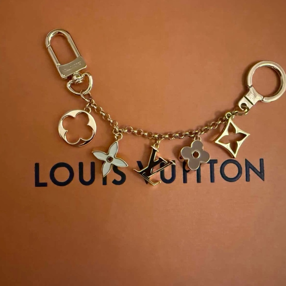 Louis Vuitton gold bag charm